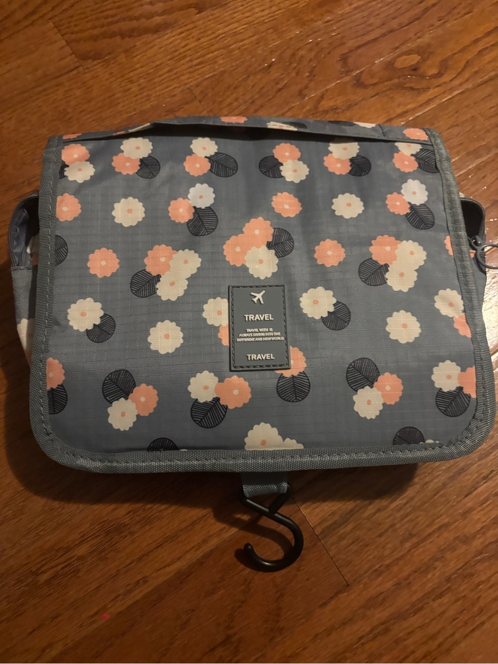 Toiletries travel bag folds hangs hardly used